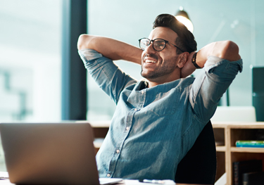 Young businessman wearing eyeglasses considering LASIK